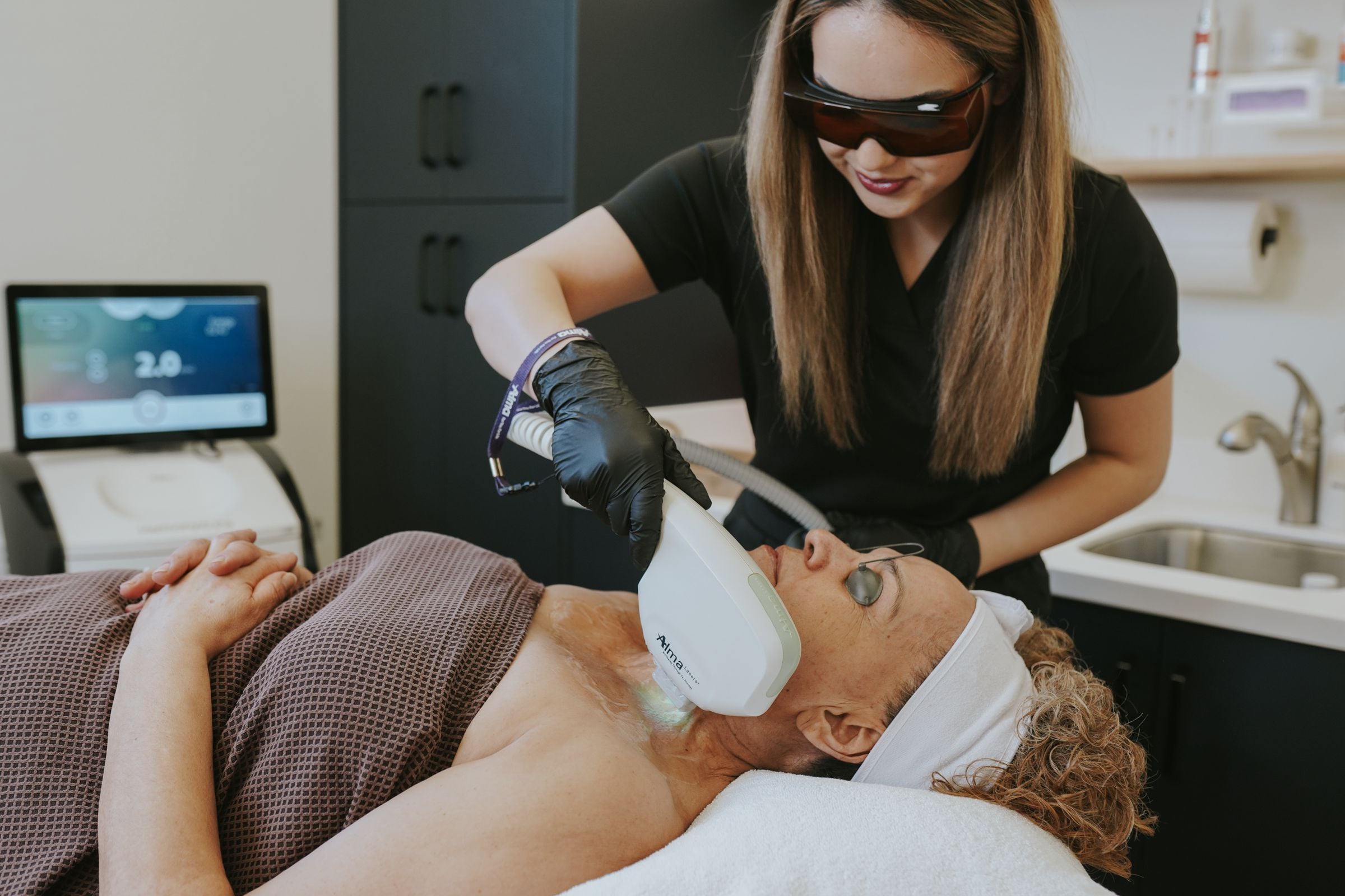 Provider performing IPL photofacial with Alma DyeVL Harmony XL Pro laser in Bozeman, Montana